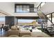 Spacious living room with modern design, floor-to-ceiling windows, and stunning city views at 21 Rockstream Dr, Henderson, NV 89012