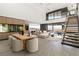 Open-concept living space featuring a dining table, modern furnishings, and mountain views at 21 Rockstream Dr, Henderson, NV 89012