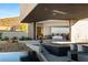Luxurious main bedroom with sliding glass doors and views of the pool and landscape at 21 Rockstream Dr, Henderson, NV 89012