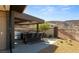 Stylish outdoor kitchen with a built-in grill, bar seating, and scenic views at 21 Rockstream Dr, Henderson, NV 89012