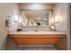 Elegant bathroom features double sinks with granite countertop and a large mirror at 211 E Flamingo Rd # 1011, Las Vegas, NV 89169