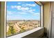Beautiful Las Vegas city view from a large picture window with clear blue skies and distant mountains at 211 E Flamingo Rd # 1011, Las Vegas, NV 89169