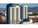 Modern exterior of The Platinum Hotel and Spa, showcasing its architecture and surrounding landscape with views of the mountains at 211 E Flamingo Rd # 1011, Las Vegas, NV 89169