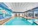 Swim laps in the indoor pool with a mural, tables, and a hot tub at 211 E Flamingo Rd # 1011, Las Vegas, NV 89169