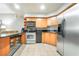 Kitchen features stainless appliances and bar-style seating and tile floor at 211 E Flamingo Rd # 1011, Las Vegas, NV 89169
