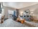 Comfortable living area in The Platinum Hotel and Spa with plush seating, a desk, and a balcony at 211 E Flamingo Rd # 1011, Las Vegas, NV 89169