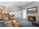 Well-appointed living room area with fireplace, television, with partial view of kitchen and dining at 211 E Flamingo Rd # 1011, Las Vegas, NV 89169