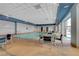 Bright indoor pool with chairs and tables on the pool deck at 211 E Flamingo Rd # 1011, Las Vegas, NV 89169