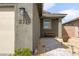 Inviting front entrance shows home number, and features a bench and covered porch adding character and charm at 2114 Cold Canyon Ave, North Las Vegas, NV 89086