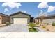 Charming home featuring a desert landscaped front yard, paver driveway and walkway, and appealing curb appeal at 2114 Cold Canyon Ave, North Las Vegas, NV 89086