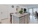 Spacious kitchen island with granite countertop and seating provides ample space for dining and food preparation at 2114 Cold Canyon Ave, North Las Vegas, NV 89086
