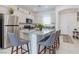 Bright kitchen with stainless steel appliances, granite countertops, and a center island with bar stool seating at 2114 Cold Canyon Ave, North Las Vegas, NV 89086