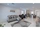 Open concept living room and kitchen provide a seamless space for entertaining, with comfortable seating at 2114 Cold Canyon Ave, North Las Vegas, NV 89086