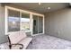 Covered patio with brick flooring and a comfortable seating area, ideal for outdoor relaxation and entertaining at 2114 Cold Canyon Ave, North Las Vegas, NV 89086