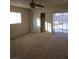 Bright bedroom with sliding door, window, and ceiling fan at 212 Bradshaw Way, Las Vegas, NV 89145