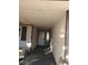 Covered front entrance with direct access from the driveway, featuring a storm door at 212 Bradshaw Way, Las Vegas, NV 89145