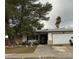 Charming single story home with a two car garage and large shade tree in the front yard at 212 Bradshaw Way, Las Vegas, NV 89145