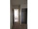 Hallway with a view of an open door to a room with tile floor at 212 Bradshaw Way, Las Vegas, NV 89145