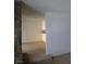 Living room with stone fireplace and view of kitchen at 212 Bradshaw Way, Las Vegas, NV 89145