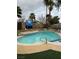 Inviting backyard pool with tile accents, step, and mature palm trees at 212 Bradshaw Way, Las Vegas, NV 89145