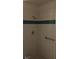 Bathroom shower with tiled walls and handrail at 212 Bradshaw Way, Las Vegas, NV 89145