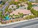 Aerial view of a home with a pool, surrounded by mature landscaping offering a peaceful and private outdoor space at 2290 Casa Bella Ct, Las Vegas, NV 89117