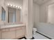 Bright bathroom featuring a sleek vanity with marble countertop and modern fixtures at 2290 Casa Bella Ct, Las Vegas, NV 89117