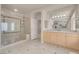 Well-lit bathroom with a glass shower, vanity, and tiled floor at 2290 Casa Bella Ct, Las Vegas, NV 89117