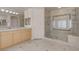 Well-lit bathroom featuring a glass shower, vanity, and tiled floor at 2290 Casa Bella Ct, Las Vegas, NV 89117