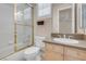Bathroom with a shower/tub combo, wood cabinets and neutral walls at 2290 Casa Bella Ct, Las Vegas, NV 89117