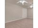 Neutral bedroom with wood floors, ceiling fans, and a closet door at 2290 Casa Bella Ct, Las Vegas, NV 89117