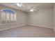 Bright bedroom with wood floors, plantation shutters and a ceiling fan at 2290 Casa Bella Ct, Las Vegas, NV 89117