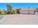 Charming home with a three car garage, brick driveway and manicured landscaping at 2290 Casa Bella Ct, Las Vegas, NV 89117