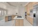 Modern kitchen with stainless steel appliances, stone countertops, and ample storage space at 2290 Casa Bella Ct, Las Vegas, NV 89117
