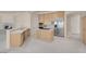 Spacious kitchen with open access, stone counters, and modern appliances, adjacent to the living space at 2290 Casa Bella Ct, Las Vegas, NV 89117