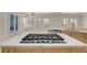 Close-up of the large kitchen island with a gas cooktop and plenty of counter space at 2290 Casa Bella Ct, Las Vegas, NV 89117