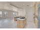 Open kitchen with stone countertops, stainless appliances, and a view into the spacious living area at 2290 Casa Bella Ct, Las Vegas, NV 89117