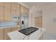 Modern kitchen with stone counters, stainless appliances and a gas cooktop on the island at 2290 Casa Bella Ct, Las Vegas, NV 89117