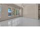 A bright living area with multiple large windows offers clear backyard views and natural light at 2290 Casa Bella Ct, Las Vegas, NV 89117