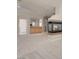 Open living space featuring a fireplace, neutral carpet, adjacent wet bar, and recessed lights at 2290 Casa Bella Ct, Las Vegas, NV 89117