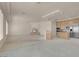 Open-concept living room featuring a fireplace, and access to the kitchen at 2290 Casa Bella Ct, Las Vegas, NV 89117