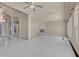 Open-concept living room with a fireplace, tile flooring, and plenty of natural light at 2290 Casa Bella Ct, Las Vegas, NV 89117