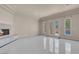 Bright and open living area with a cozy fireplace and seamless access to outdoor living at 2290 Casa Bella Ct, Las Vegas, NV 89117