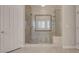 Tiled shower with glass enclosure, offering a luxurious bathing experience at 2290 Casa Bella Ct, Las Vegas, NV 89117