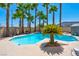 Backyard swimming pool with palm trees and hot tub, perfect for outdoor entertaining at 2290 Casa Bella Ct, Las Vegas, NV 89117