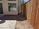 This backyard features desert landscaping, concrete slabs and new fencing at 2606 Heartland Ave, Henderson, NV 89074