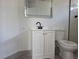 Bathroom with white cabinet, modern faucet and mirror at 2606 Heartland Ave, Henderson, NV 89074