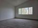 Bedroom with wood-look flooring and window views at 2606 Heartland Ave, Henderson, NV 89074