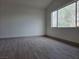 Bedroom with wood-look flooring and a large window at 2606 Heartland Ave, Henderson, NV 89074