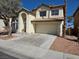 Charming two-story home featuring a tile roof, attached garage, and well-maintained landscaping at 2606 Heartland Ave, Henderson, NV 89074